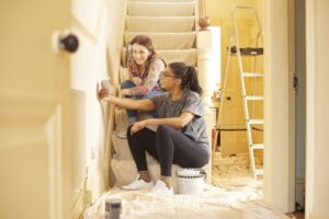 Why Is Remodeling My Home in the Fall or Winter a Better Time? Female couple choosing swatch colors.