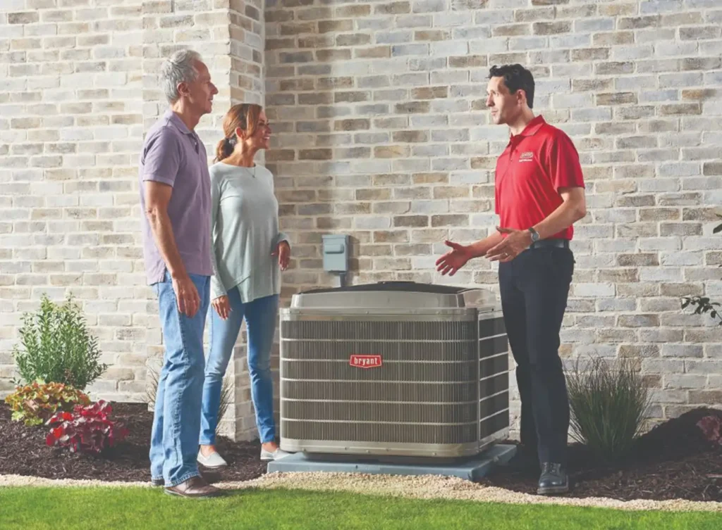 Bryant authorized dealer explaining the benefits of heat pump maintenance to homeowners springfield il