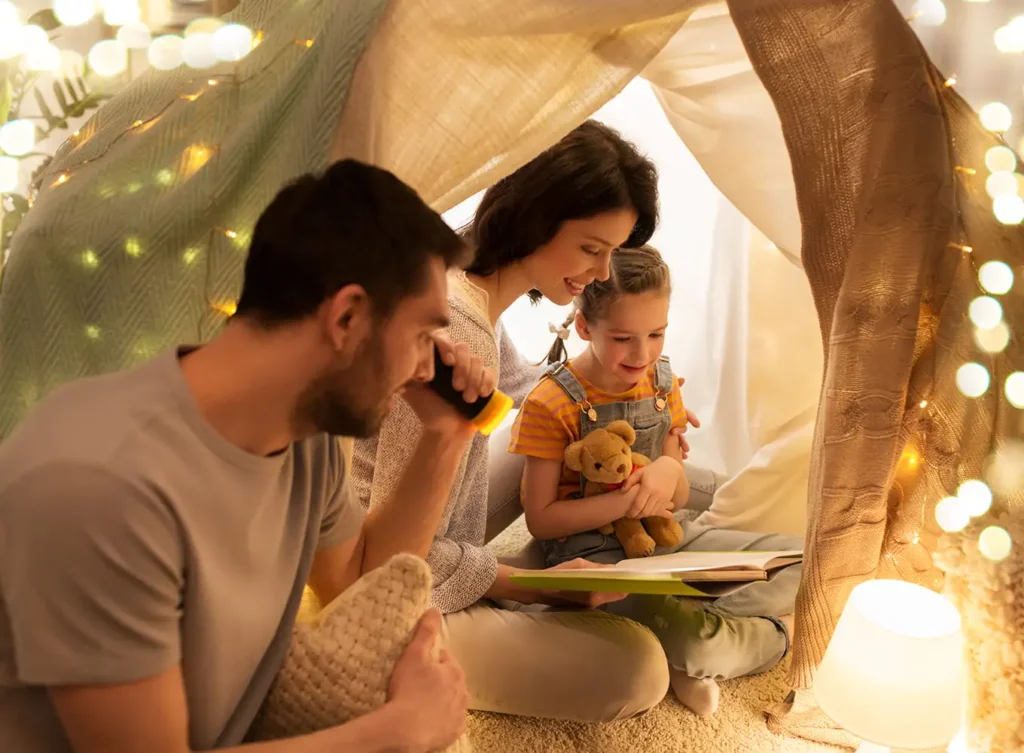 young family cozy under a indoor tent