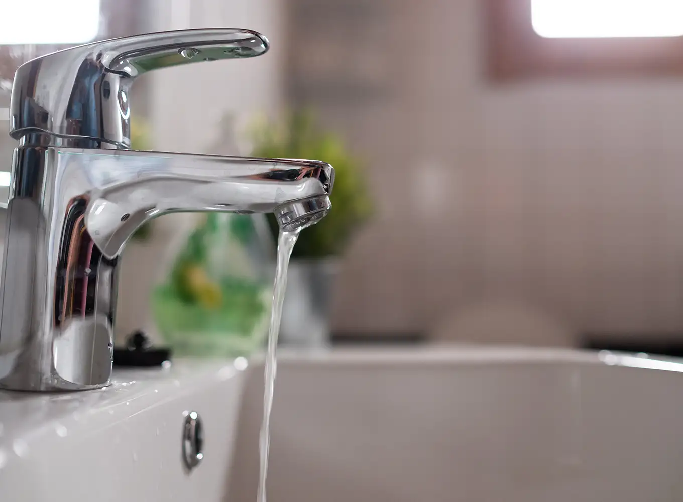 a bathroom faucet running smoothly from plumbing services performed by top plumbers in jacksonville il