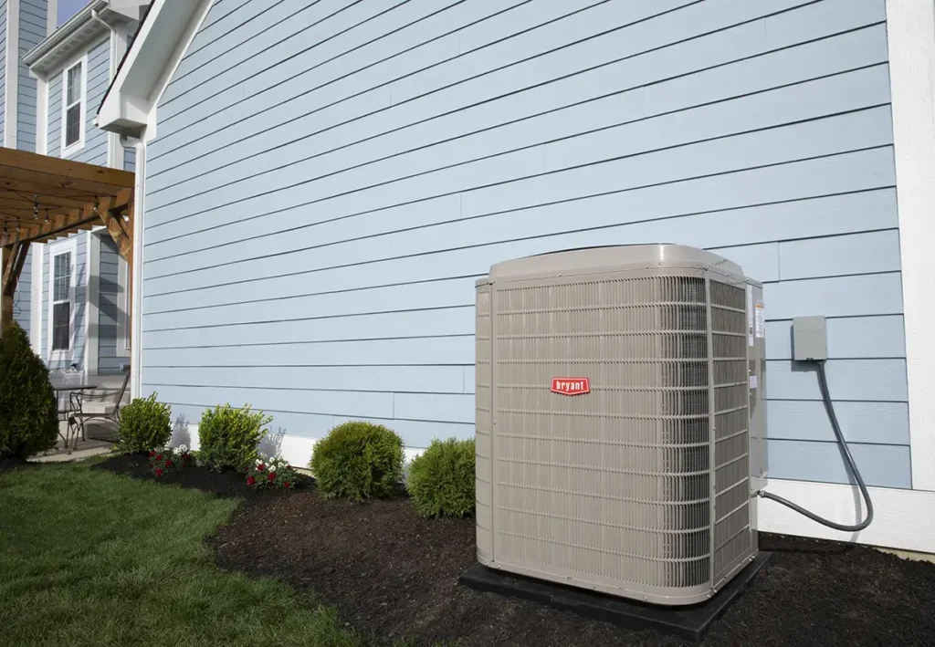 Bryant heat pump installed outside of house for energy-efficiency springfield il