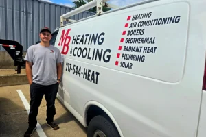 Wade Slovick standing next to MB Heating & Cooling Work Truck in Springfield, IL.